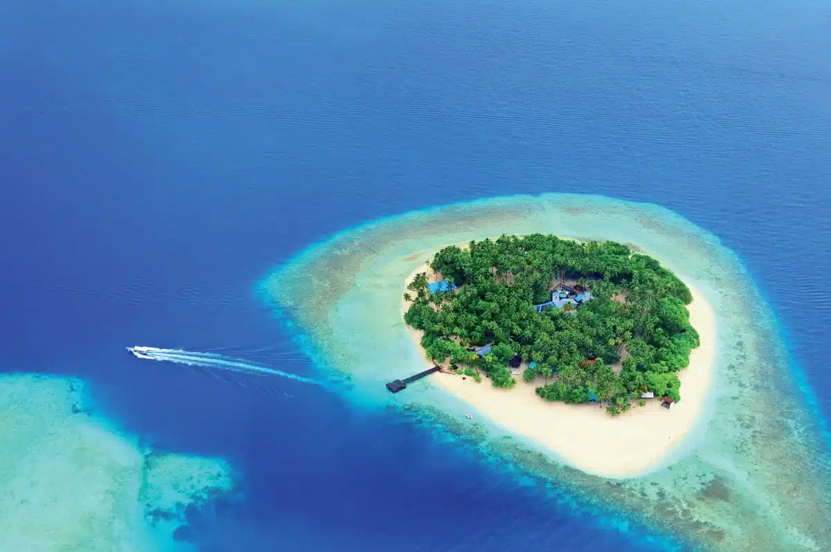 Small tropical island in the ocean Maldives. Shot was taken from seaplane.