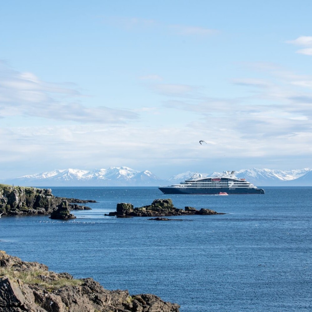 PONANT EXPLORATIONS vessel Le Bellot sailing off the island of Grimsey in Iceland