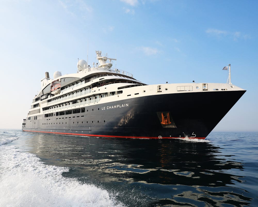 Le Champlain sailing through open waters, embodying the spirit of exploration that defines PONANT EXPLORATIONS.